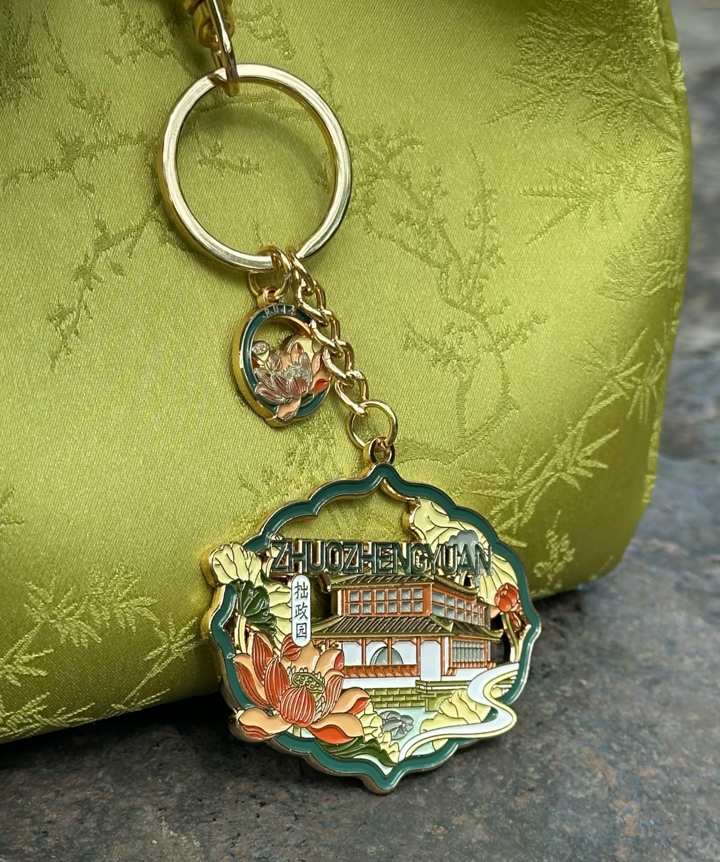 Garden-inspired metal keychain with colorful detailing