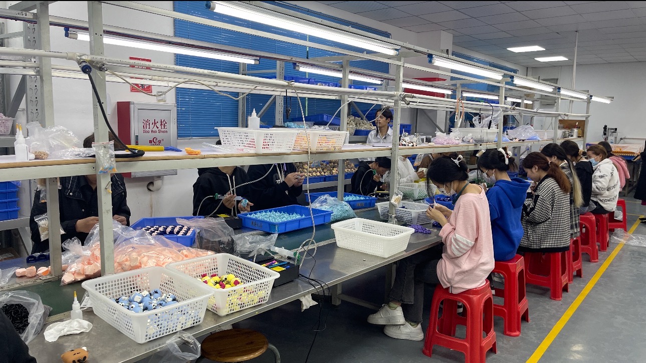 Factory team working along a production line
